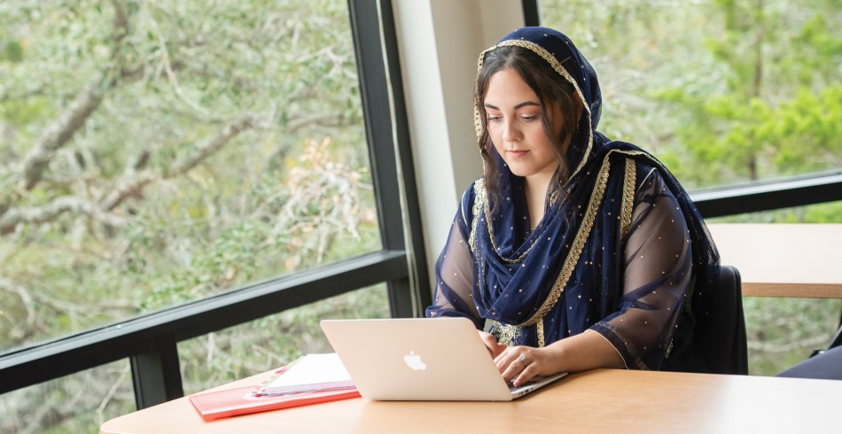 Student working diligently on an essay