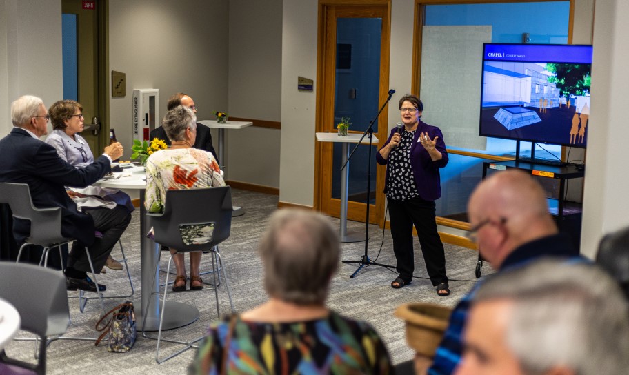 Dr. Kirk addressing the community during a public forum