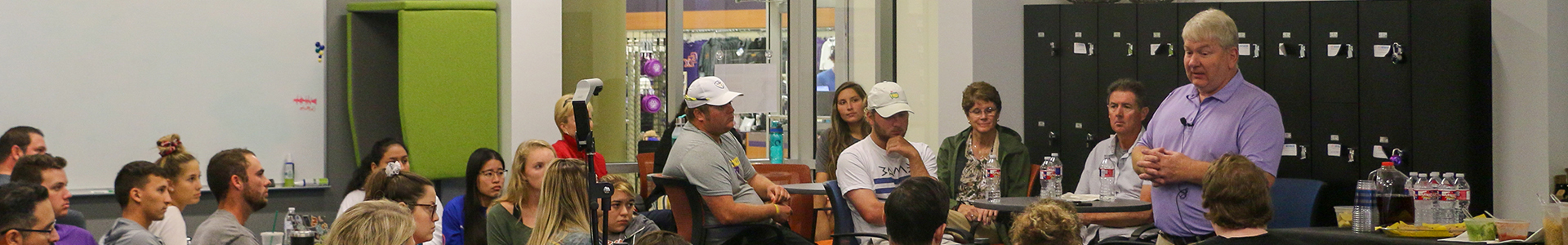 Students on Campus learning from a business professional