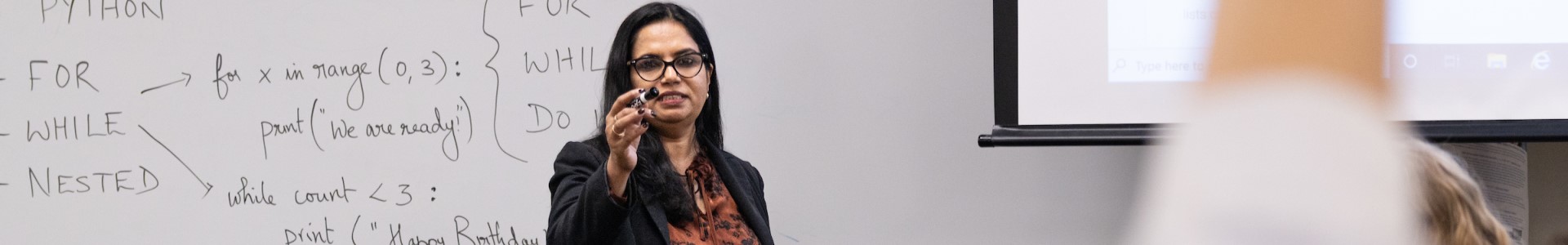 Dr. George teaching a class in computer science