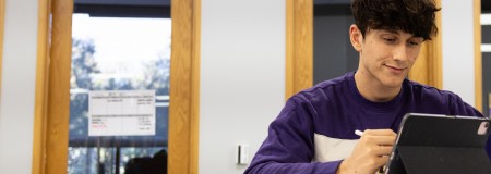 A CTX student working on his BBA