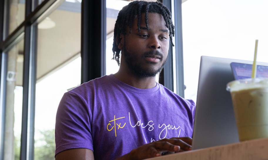 A CTX student working on campus