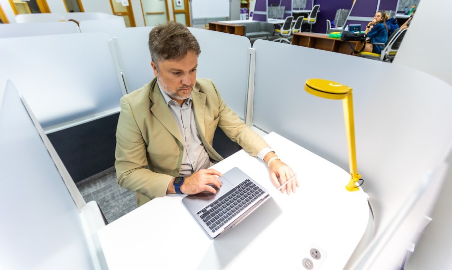 A graduate student studying in the student development center