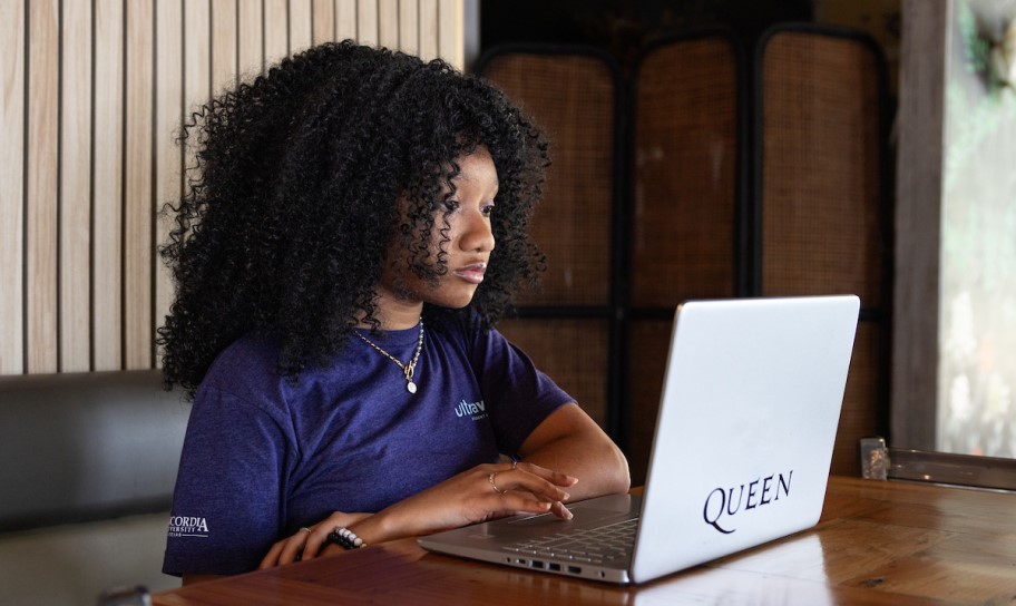 A CTX student working on her laptop