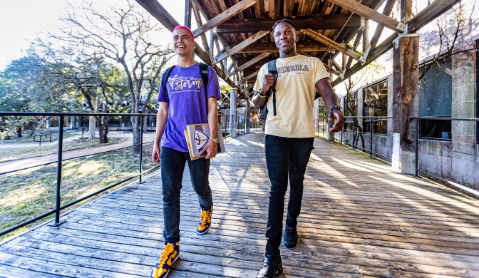 Two international students walking across Concordia University Texas