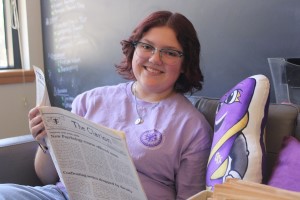 Concordia Texas student reading a newspaper