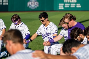 A group of CTX Athletes praying together