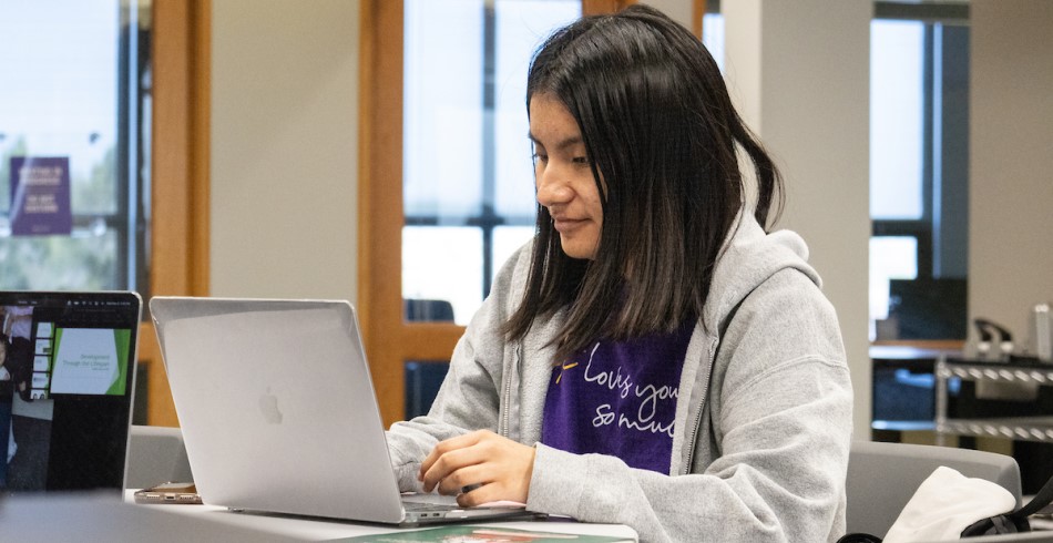 Concordia University Texas student working on source code for a computer science class.