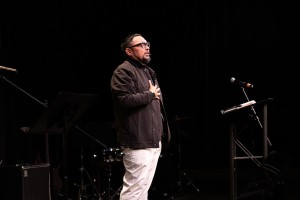 Rev. Dr. Chris Holder leading worship