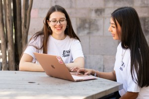 A pair of Concordia University Texas students working together on campus