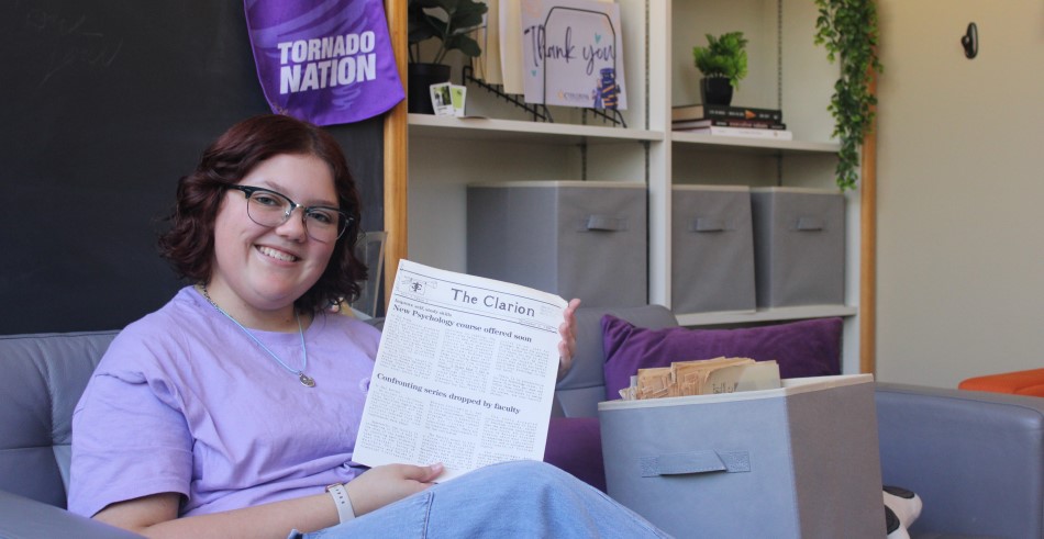 Abby Shaivitz reading an article from The Clarion