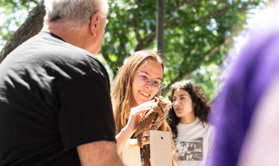 Students interacting with birds of prey