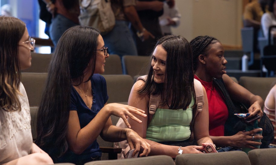 People in conversation in chapel